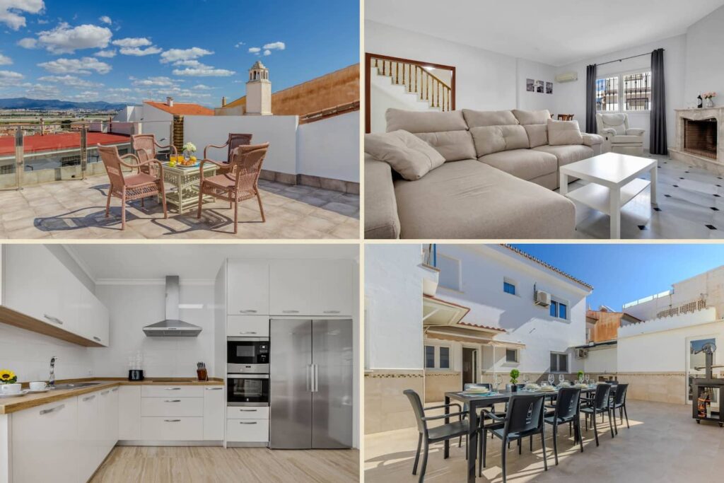 Una terraza con una mesa y sillas, una cocina con un horno y un refrigerador, y un salón con un sofá y una mesa